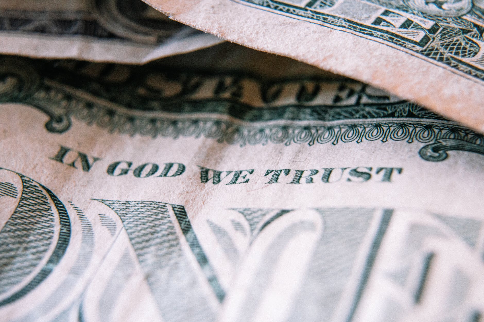 Prioritizing Debt Repayment - one dollar banknotes placed on table